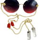 Zensational fashion eyewear by Orion Elise. Chain link glasses with striking red frame and gold custom red deity head chain. Clear quartz on ends radiates purity and clarity. Empower yourself and embrace your true potential with Zensational.