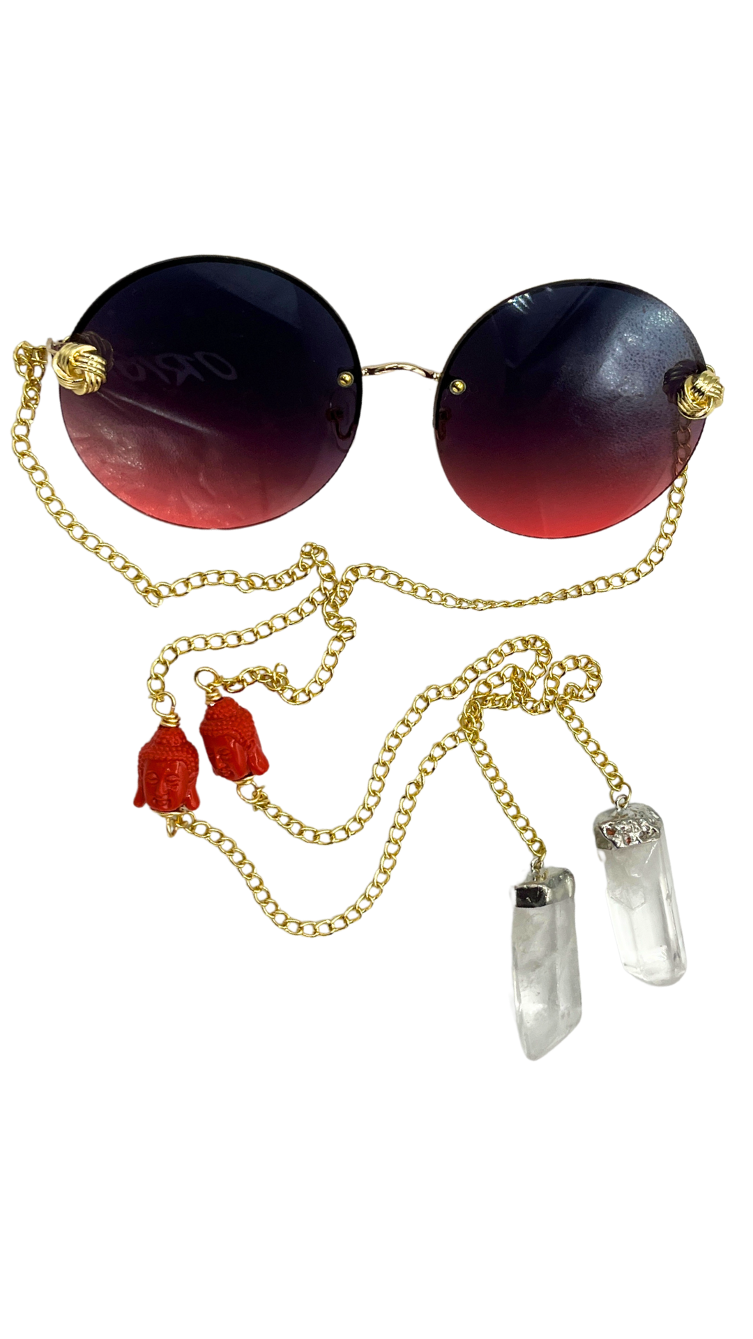 Zensational fashion eyewear by Orion Elise. Chain link glasses with striking red frame and gold custom red deity head chain. Clear quartz on ends radiates purity and clarity. Empower yourself and embrace your true potential with Zensational.