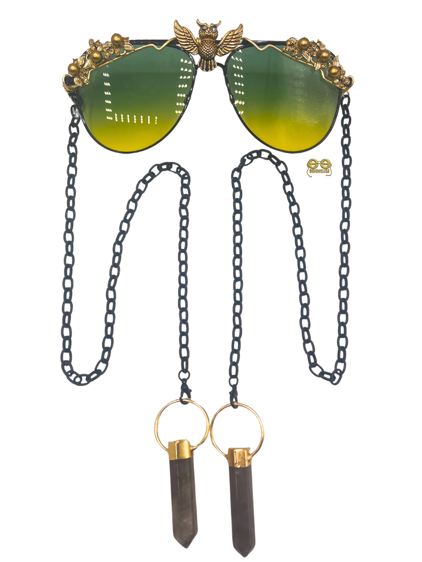 "All The Wiser" fashion eyewear by Orion Elise. Handcrafted black wire frame with captivating ombré lens transitioning from emerald green to golden yellow. Delicate gold wire accents and black chain with mesmerizing tourmaline stone.