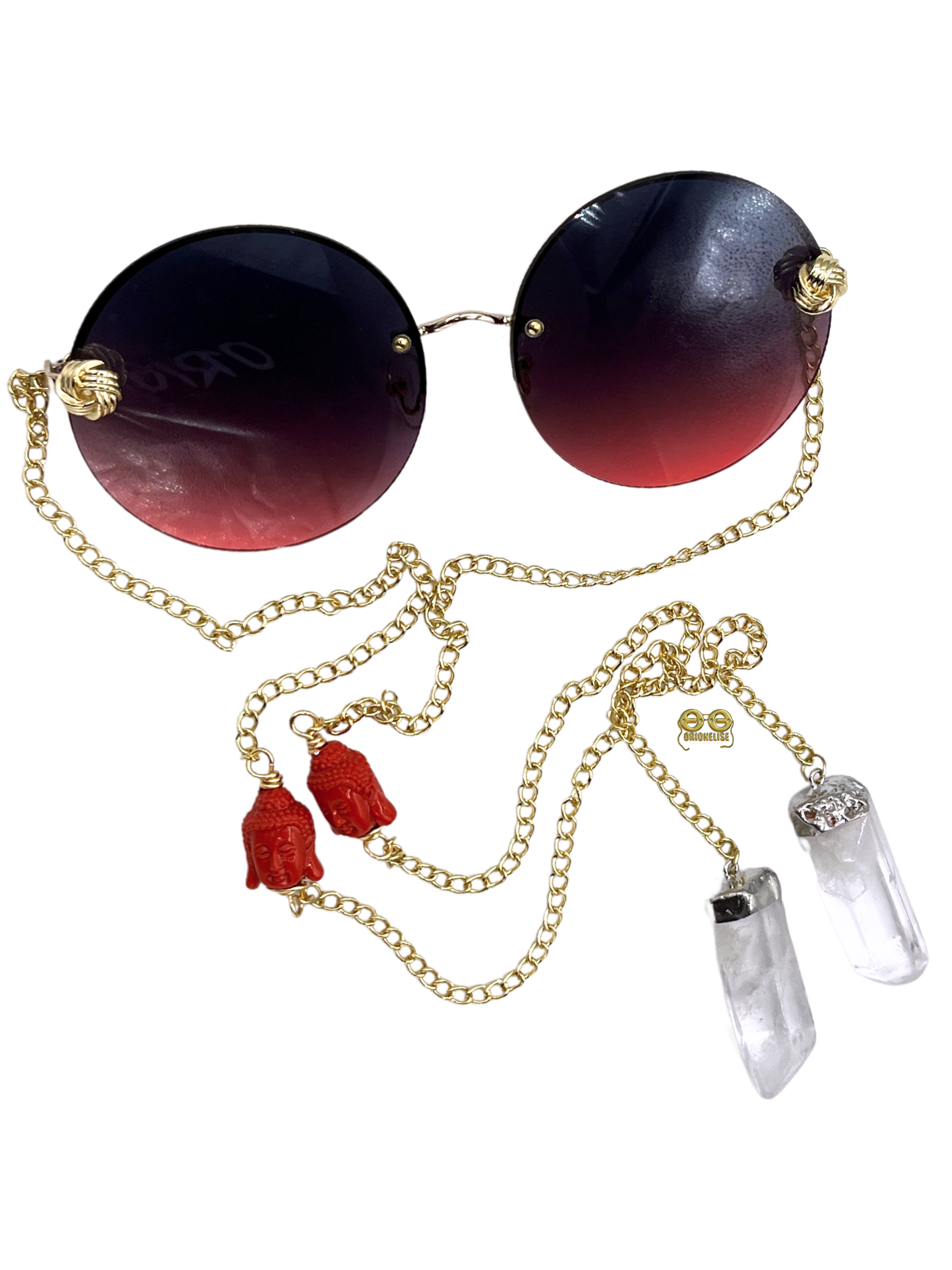 Zensational fashion eyewear by Orion Elise. Chain link glasses with striking red frame and gold custom red deity head chain. Clear quartz on ends radiates purity and clarity. Empower yourself and embrace your true potential with Zensational.